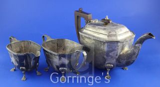 A George V three piece silver tea set by Mappin & Webb, of octagonal form, with fan engraved border,