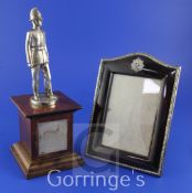 A George V silver and tortoiseshell mounted photograph frame, of rectangular form with domed top and