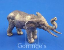 A 1980's silver miniature free standing model of an Indian elephant by John Silvant & Margurite