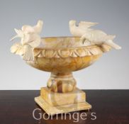 A 19th century carved alabaster model of Pliny's doves, the four birds perched on the edges of an