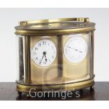 An early 20th century Duvernoy brass combined carriage timepiece and barometer, of oval form,