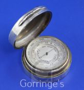 A late Victorian silver cased brass pocket barometer, of circular form, the hinged lid engraved with
