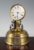 A Eureka Clock Co Ltd lacquered brass patent electric timepiece, with glass dome, enamelled Roman