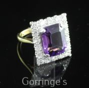 An 18ct gold and platinum, amethyst and diamond tablet ring, set with emerald cut amethyst within
