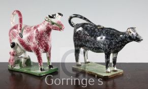 Two Yorkshire type pearlware cow creamers, c.1820, the first modelled with a milkmaid and pail