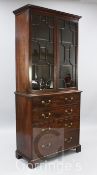 A George III mahogany bookcase, with moulded cornice and two astragal glazed doors over four