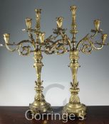 A pair of mid 19th century Continental ormolu five light candelabra, with foliage scroll branches,