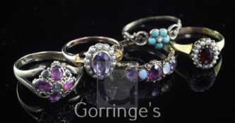 Five late 19th/early 20th century gold and gem set rings, including 15ct gold half hoop and 18ct