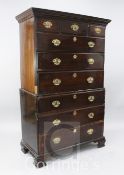 A George II mahogany and tulipwood banded chest on chest, fitted three short and six graduated