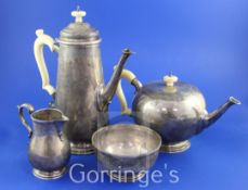 A George V 18th century style silver four piece tea and coffee service by Goldsmiths &