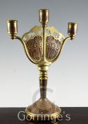 An Erhard & Sohne Schwabisch Gmund rosewood and gilt brass three light candelabrum, decorated with