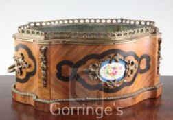 A 19th century French ormolu mounted kingwood jardiniere, inset with porcelain panels painted with
