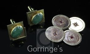 A pair of modern two colour 9ct gold and ruby oval cufflinks, with central star motif, gross