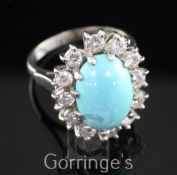 An early 1980's 18ct white gold, turquoise and diamond oval cluster ring, the central oval