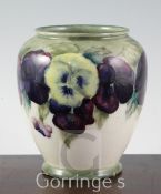 A William Moorcroft "Pansy" pattern ovoid vase, c.1918, with pale green to cream graduated ground,