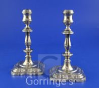 A pair of George V 18th century style silver candlesticks by Mappin & Webb, with turned knopped