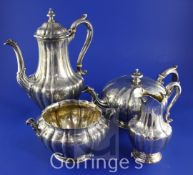 An early Victorian four piece silver tea and coffee set, of fluted baluster form, with melon