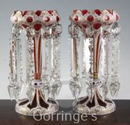 A pair of Bohemian ruby and white overlaid glass table lustres, late 19th century, with arched and
