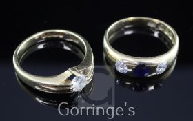 A late Victorian 18ct gold and gypsy set three stone sapphire and diamond ring and an Edwardian 18ct