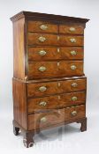 A George III mahogany chest on chest, with dentil cornice, two short and six graduated long drawers,