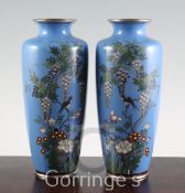 A pair of Japanese silver wire cloisonne enamel vases, early 20th century, each decorated with a