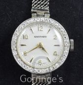 A lady's 1950's Swiss platinum and diamond set cocktail watch retailed by Garrard, with Arabic and