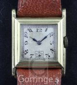 A gentleman's late 1920's 18ct gold manual wind wristwatch, with stepped square case and Arabic dial