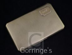 A George V engine turned 9ct gold cigarette case, of rectangular form, with canted corners and