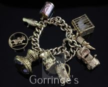 A 9ct gold curb link charm bracelet, hung with seven 9ct gold charms, including golf bag,