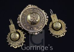 A Victorian gold demi-parure, comprising a brooch and pair of earrings, of circular form, with domed