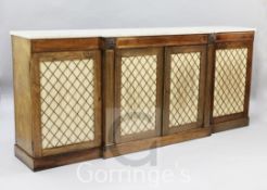 A Regency brass inset rosewood breakfront dwarf bookcase, with later marble top and four brass