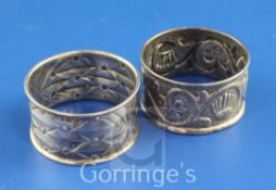 Two George V Arts & Crafts Keswick School of Industrial Art repousse silver napkin rings, with