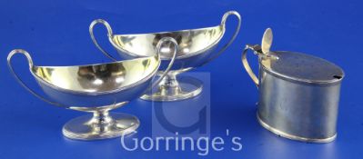 A pair of George III silver boat shaped two handled pedestal salts, with reeded bands, on oval foot,