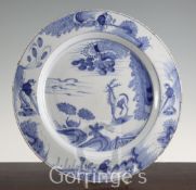 A Dublin delft ware blue and white charger, c.1760, painted to the centre with a stag in a