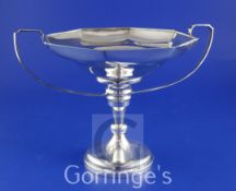 A George V silver two handled octagonal comport, on turned tapering stem with circular foot,