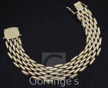 A 1960's heavy 9ct gold brick link bracelet, 7.75in.