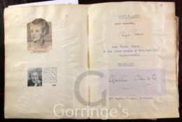 An autograph album - lined notebook containing twenty signed photographs, including: Agatha Christie