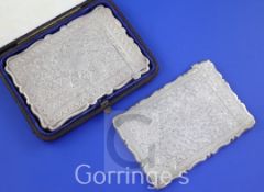 A late Victorian silver card case by George Unite, with engraved foliate decoration, Birmingham,