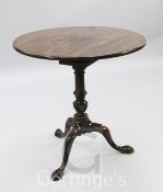 A George III mahogany tea table, with circular top and birdcage, on turned spiral fluted baluster