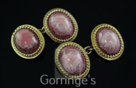 A pair of 18ct gold and cabochon rhodonite oval cufflinks, with ropetwist borders, gross weight 15.3