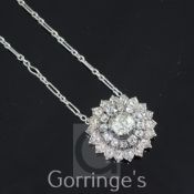 A Victorian gold, silver and diamond cluster sunburst pendant, with central cushion cut diamond