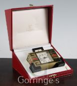 A Must de Cartier enamelled and lacquered brass desk timepiece, with stylised Greek key decoration