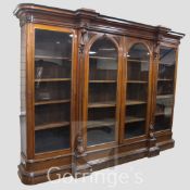 A Victorian ebony banded oak breakfront library bookcase, with moulded cornice and two central