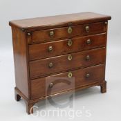 A George II red walnut bachelor's chest, with folding top resting on lopers over four graduated long