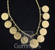 A 14ct gold necklace hung with ten Turkish 100 piastres gold coins and one 250 piastres gold coin.