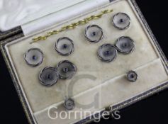 A 1920's cased 18ct gold, frosted glass and blue cabochon set eight piece dress stud set, of