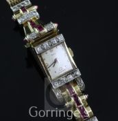 A lady's 1950's? gold, cabochon ruby and diamond set Frey cocktail watch, the rectangular dial