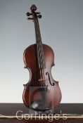 A violin, probably by F.W. Chanot, London 1900, after G. Guarneri the two piece back 14in. long,