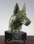 M. Leducq. An Art Deco bronzed spelter model of the head of an Alsatian, signed, on black marble