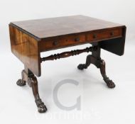 A Regency rosewood sofa table, with rounded flaps and two frieze drawers, on end standards with